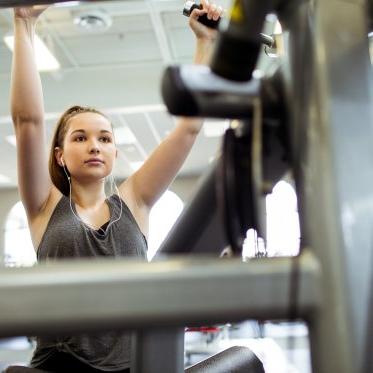 Student using weight machine