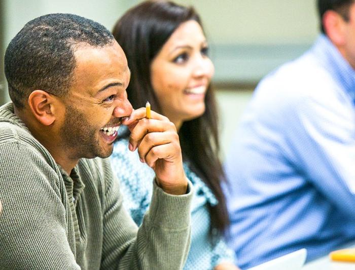 Executive MBA students enjoying class together on campus