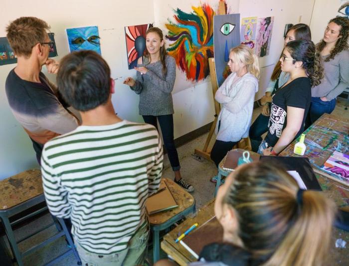 People gathering in an art exhibit