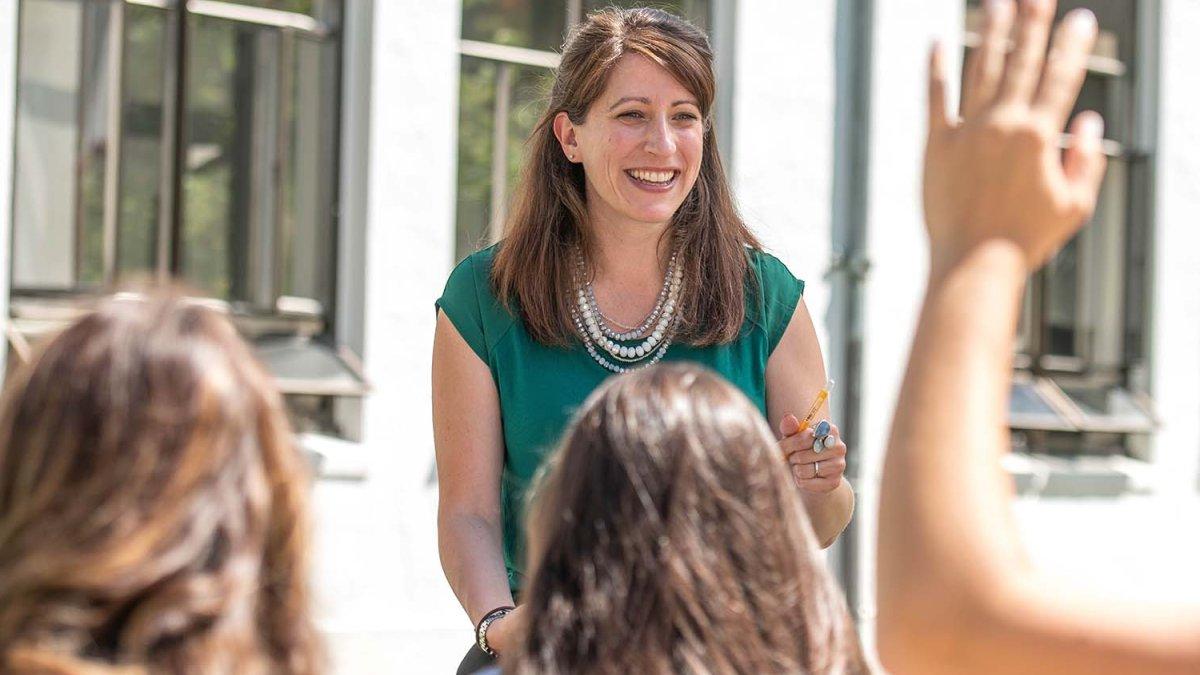 teacher laughs during outdoor class